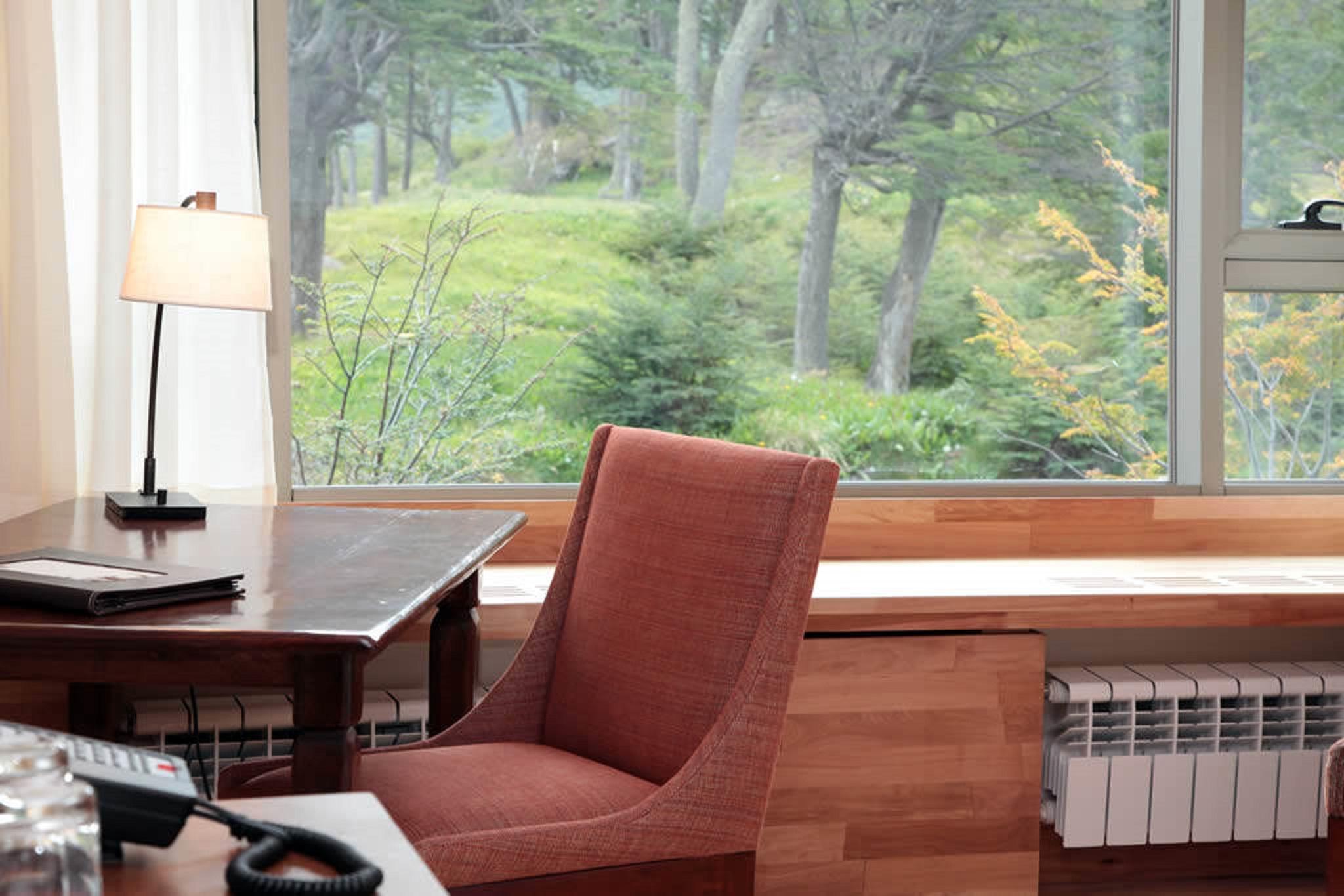 Arakur Ushuaia Resort & Spa Kültér fotó A view of the woods from the library